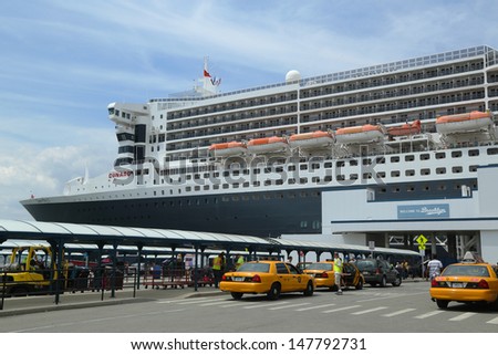 NEW YORK CITY - JULY 27: Queen Mary 2 cruise ship docked at Brooklyn Cruise Terminal on July 27, 2013. Queen Mary 2 is CunardÃ¢Â?Â?s flagship ready for Transatlantic Crossing  from New York to  Southampton