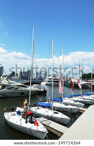 NEW YORK CITY - AUGUST 6: Manhattan Sailing School yachts at the North Cove Marina at Battery Park  on August 6, 2013