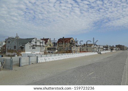 FAR ROCKAWAY, NY - OCTOBER 22: Protective barrier build to prevent damage in devastated residential area one year after Hurricane Sandy on October 22, 2013 in Far Rockaway, NY.