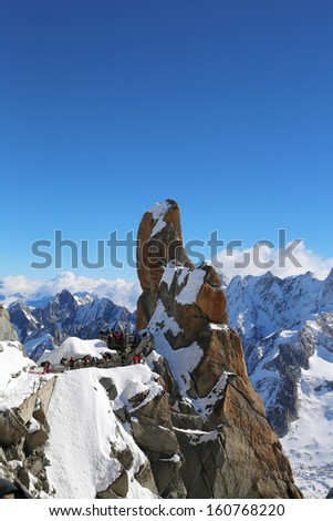 AUGUILLE DU MIDI, FRANCE -OCTOBER 9: Peak and observation point Rebuffat at the mountain top station of the Aiguille du Midi 3842 m in French Alps on October 9, 2013
