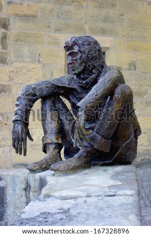 SARLAT, FRANCE - OCTOBER 7: The Badaud statue by Gerard Auliac at the Freedom Square in Sarlat on October 7, 2013. The badaud is an important urban type from 18th and 19th-century French literature