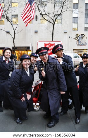 NEW YORK - DECEMBER 19: Salvation Army soldiers perform for collections on December 19, 2013 in midtown Manhattan. This Christian organization is known for its charity work, operating in 126 countries