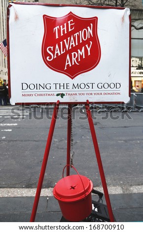 NEW YORK - DECEMBER 19  Salvation Army red kettle for collections on December 19, 2013 in midtown Manhattan  This Christian organization is known for its charity work, operating in 126 countries