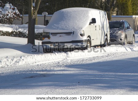 BROOKLYN, NEW YORK - JANUARY 22: Car under snow on January 22, 2014 in Brooklyn, NY after massive Winter Storm Janus strikes Northeast. Foot of snow hits NYC as Northeast reels from Winter Storm Janus