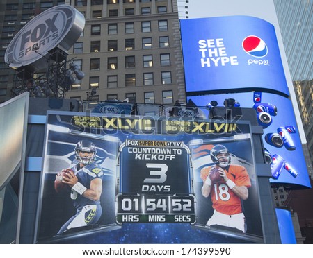 NEW YORK - JANUARY 30: Fox Sports broadcast set on Times Square with the clock counting time till Super Bowl XLVIII match in Manhattan on January 30, 2014