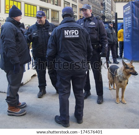 NEW YORK - JANUARY 30  NYPD counter terrorism officers and NYPD transit bureau K-9 police officer with K-9 dog providing security on Broadway during Super Bowl XLVIII week on January 30, 2014