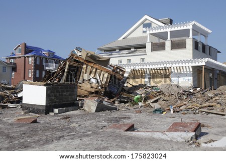 FAR ROCKAWAY, NY - NOVEMBER 11: Destroyed beach houses in the aftermath of Hurricane Sandy on November 11, 2012 in Far Rockaway, NY. Image taken 12 days after Superstorm Sandy hit New York