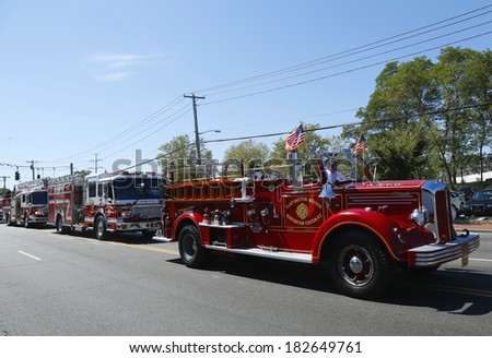 HUNTINGTON, NY - SEPTEMBER 7:1950 Mack fire truck from Huntington Manor Fire Department leading firetrucks parade in Huntington on September 7, 2013. Huntington Manor Fire Department organized in 1903