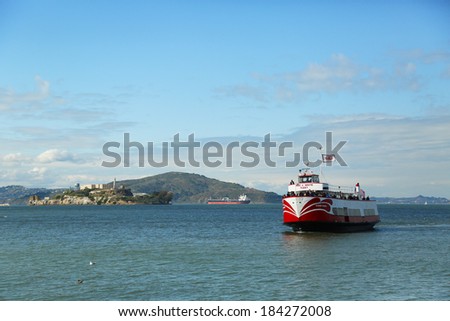 SAN FRANCISCO,CA - MARCH 28: Red and White Fleet boat docking at Pier 43 in Fisherman\'s Wharf on March 28, 2013. It offers sailings under the Golden Gate Bridge and around Alcatraz since 1892