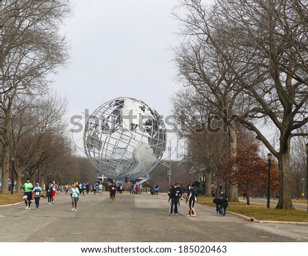 NEW YORK - MARCH 22:Runners participating at Michelob ULTRA New York 13.1 Marathon run in front of Unisphere within Flushing Meadows Corona Park home of the 1939 and 1964 Worlds Fair on March 22, 2014