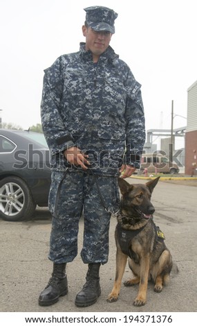NEW YORK - MAY 22  Unidentified navy with K-9 dog providing security during Fleet Week 2014 on May 22, 2014 in New York