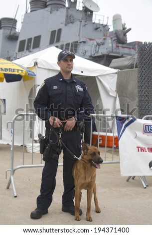 NEW YORK - MAY 22  NYPD counter terrorism officer with Belgian shepherd providing security during Fleet Week 2014 on May 22, 2014 in New York