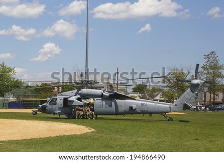 FREEPORT, NEW YORK - MAY 25: MH-60S helicopter from Helicopter Sea Combat Squadron Five with US Navy EOD team taking off after mine countermeasures demonstration during Fleet Week 2014 on May 25, 2014