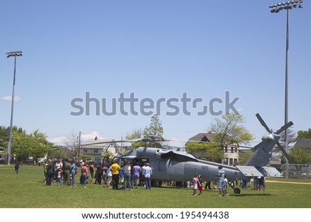 FREEPORT, NEW YORK - MAY 25  Numerous spectators around MH-60S helicopter from Helicopter Sea Combat Squadron Five during Fleet Week 2014 on May 25, 2014 in Long Island