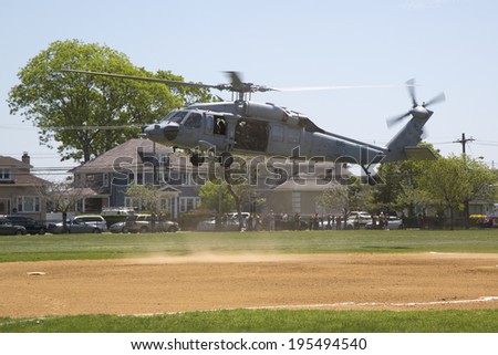FREEPORT, NEW YORK - MAY 25  MH-60S helicopters from Helicopter Sea Combat Squadron Five with US Navy EOD team landing for mine countermeasures demonstration during Fleet Week 2014 on May 25, 2014