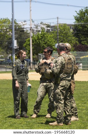 FREEPORT, NEW YORK - MAY 25 Unidentified US Navy s from EOD team and unidentified helicopter pilot after mine countermeasures demonstration during Fleet Week 2014 in Long Island on May 25, 2014