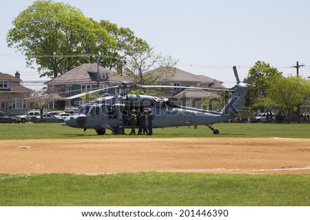 FREEPORT, NEW YORK - MAY 25 MH-60S helicopter from Helicopter Sea Combat Squadron Five with US Navy EOD team taking off after mine countermeasures demonstration during Fleet Week 2014 on May 25, 2014