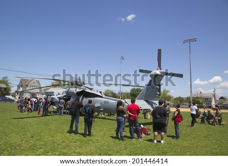 FREEPORT, NEW YORK - MAY 25 Numerous spectators around MH-60S helicopter from Helicopter Sea Combat Squadron Five during Fleet Week 2014 on May 25, 2014 in Long Island