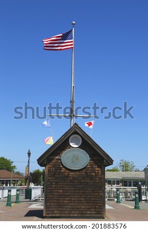 FREEPORT, NEW YORK - MAY 29: American flag and nautical flags flying at Woodcleft Esplanade in Freeport, Long Island on May 29, 2014