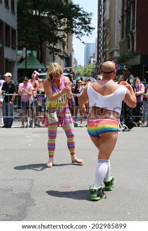 NEW YORK - June 29, 2014: LGBT Pride Parade participants in New York City on June 29, 2014. LGBT pride march takes place during pride week and is the culmination of week long festivities