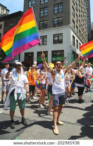 NEW YORK - June 29, 2014: LGBT Pride Parade participants in New York City on June 29, 2014. LGBT pride march takes place during pride week and is the culmination of week long festivities