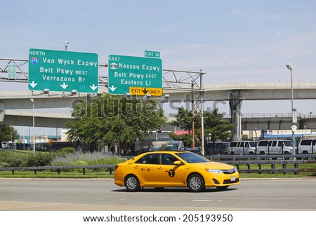 NEW YORK - JULY 10: New York Taxi at Van Wyck Expressway entering JFK International Airport in New York on July 10, 2014. JFK is the busiest international air passenger gateway in the United States