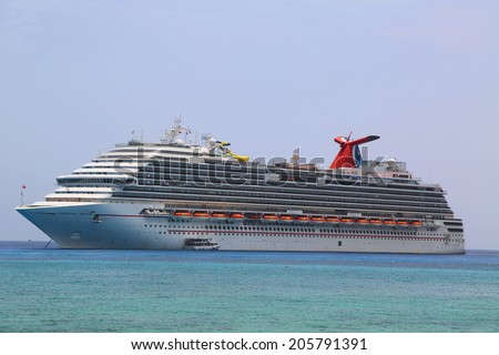 GRAND CAYMAN - JUNE 11: Carnival Dream Cruise Ship anchors at the Port of George Town, Grand Cayman on June 11, 2014. Carnival Dream has capacity of 3652 passengers and crew of 1369