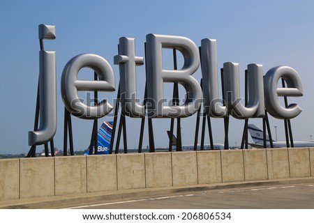 NEW YORK- JULY 10: JetBlue sign at the Terminal 5 at John F Kennedy International Airport in New York on July 10, 2014. JFK is one of the biggest airports in the world with 4 runways and 8 terminals