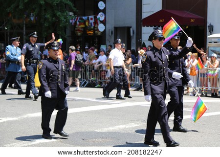 NEW YORK - June 29, 2014: FDNY members at LGBT Pride Parade in New York City on June 29, 2014. LGBT pride march takes place during pride week and is the culmination of week long festivities