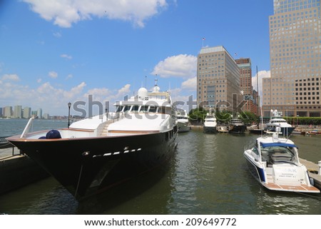 NEW YORK CITY - AUGUST 7: Mega yachts docked at the North Cove Marina at Battery Park in Manhattan on August 7, 2014