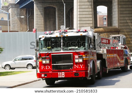 BROOKLYN, NY  - JUNE 17: FDNY Tower Ladder 118 truck in Brooklyn on June 17, 2014. FDNY is the largest combined Fire and EMS provider in the world