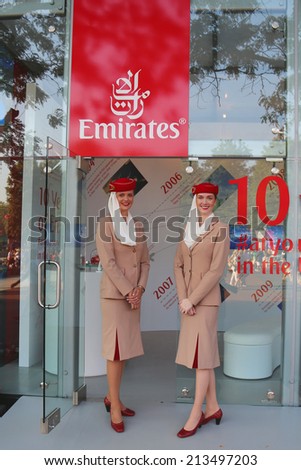 NEW YORK - AUGUST 26: Emirates Airlines flight attendants at the Emirates Airlines booth at the Billie Jean King National Tennis Center during US Open 2014 on August 26, 2014 in New York