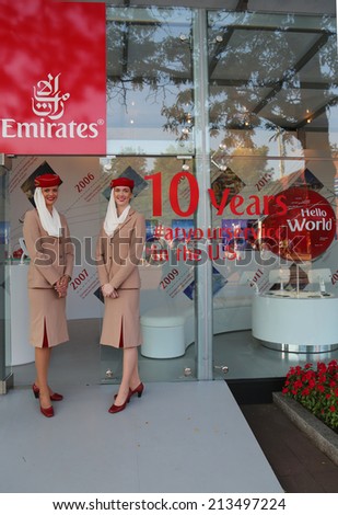 NEW YORK - AUGUST 26: Emirates Airlines flight attendants at the Emirates Airlines booth at the Billie Jean King National Tennis Center during US Open 2014 on August 26, 2014 in New York