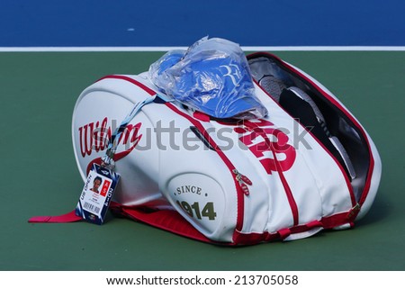 NEW YORK - AUGUST 26 Grand Slam Champion Roger Federer customized Wilson tennis bag at US Open 2014 at Billie Jean King National Tennis Center on August 26, 2014 in New York