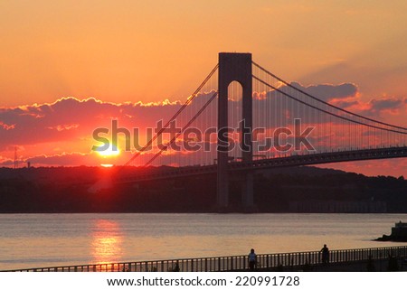 NEW YORK - SEPTEMBER 18:Verrazano Bridge at sunset in New York on September 18, 2014.The Verrazano Bridge is a double-decked suspension bridge that connects the boroughs of Staten Island and Brooklyn