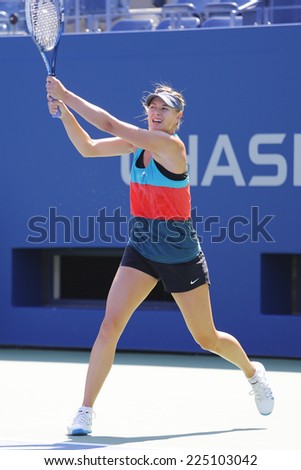 NEW YORK - AUGUST 19: Four times Grand Slam champion Maria Sharapova practices for US Open at Arthur Ashe Stadium at Billie Jean King National Tennis Center on August 19, 2014 in New York