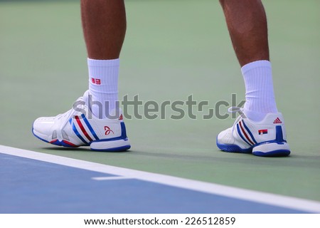 NEW YORK - SEPTEMBER 1 Six times Grand Slam champion Novak Djokovic wears custom Adidas tennis shoes during match at US Open 2014 at Billie Jean King National Tennis Center on September 1, 2014 in NY