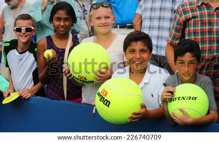 NEW YORK - SEPTEMBER 1: Young tennis fans waiting for autographs at Billie Jean King National Tennis Center on September 1, 2014 in New York. US Open is a final Grand Slam tournament of the year