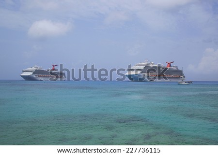 GRAND CAYMAN - JUNE 12: Carnival Dream  and Carnival Glory Cruise Ships anchor at the Port of George Town, Grand Cayman on June 12, 2014.