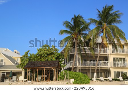 GRAND CAYMAN - JUNE 10: Luxury condominium located on the Seven Miles Beach at Grand Cayman on June 10, 2014. Seven Mile Beach is the most populated area for hotels and resorts on the island