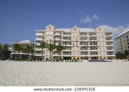 GRAND CAYMAN - JUNE 12: Luxury condominium located on the Seven Miles Beach at Grand Cayman on June 12, 2014. Seven Mile Beach is the most populated area for hotels and resorts on the island