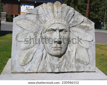 BANFF, CANADA - JULY 29: First Nations relief of Indian Chief by James Thompson in the front of Whyte Museum of the Canadian Rockies in Banff National Park on July 29, 2014