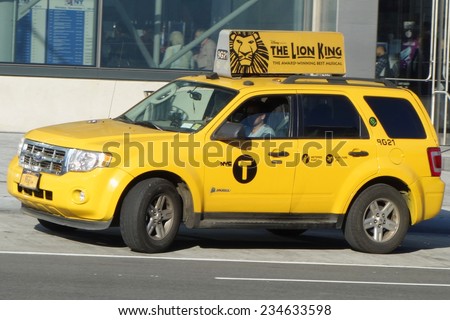 NEW YORK - DECEMBER 1: New York City Taxi on December 1, 2014. New York  has around 6,000 hybrid taxis, representing almost 45 percent of the taxis in service, the most in any city in North America