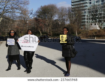 BROOKLYN, NEW YORK - DECEMBER 14: Protesters march against police brutality and grand jury decision on Eric Garner case on Grand Army Plaza in Brooklyn on December 14, 2014