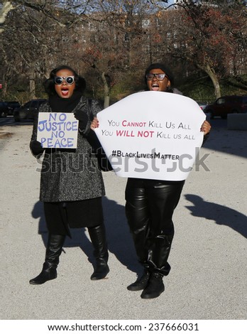 BROOKLYN, NEW YORK - DECEMBER 14: Protesters march against police brutality and grand jury decision on Eric Garner case on Grand Army Plaza in Brooklyn on December 14, 2014