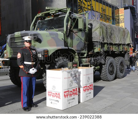 NEW YORK - DECEMBER 18: U. S. Marine during U.S Marine Corps Reserve Toys for Tots Program collection at the Times Square on December 18, 2014 in midtown Manhattan.