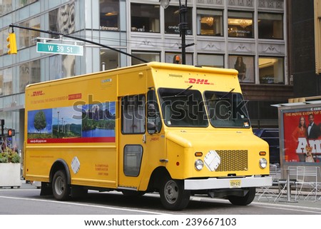 NEW YORK - DECEMBER 18 DHL van in midtown Manhattan on December 18, 2014. DHL is a world wide courier company that operates in 220 countries with over 285,000 employees