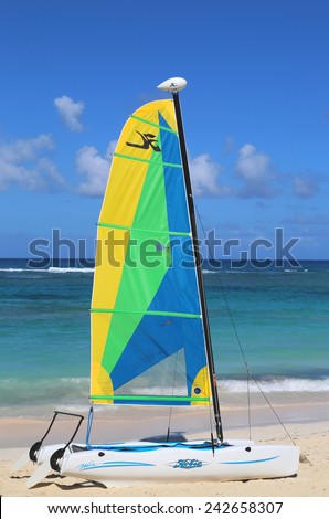 PUNTA CANA, DOMINICAN REPUBLIC - DECEMBER 31, 2014: Hobie Cat catamaran ready for tourists at Bavaro Beach in Punta Cana. The Dominican Republic is the most visited destination in the Caribbean