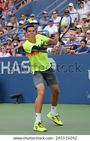 NEW YORK - AUGUST 30, 2014:  Professional tennis player Miols Raonic from Canada during third round match at US Open 2014 at Billie Jean King National Tennis Center in New York