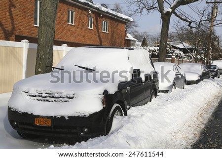BROOKLYN, NEW YORK - JANUARY 27, 2015: Cars under snow in Brooklyn, NY after massive Winter Storm Juno strikes Northeast.